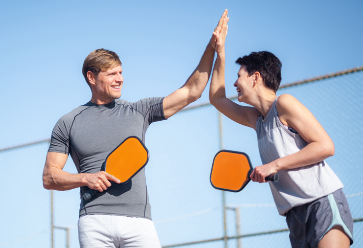 Doctor assisting patient with arm movement
